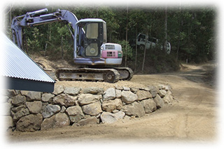 A Bush-rock Boulder Wall for a Garage & Driveway